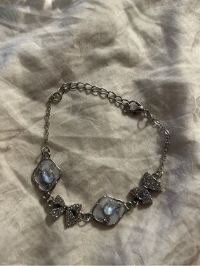 Silver Crystal Bow Bracelet with Iridescent Stones